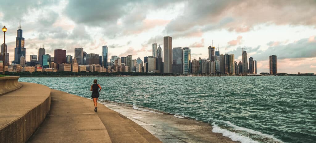 Woman running among Chicago skyline